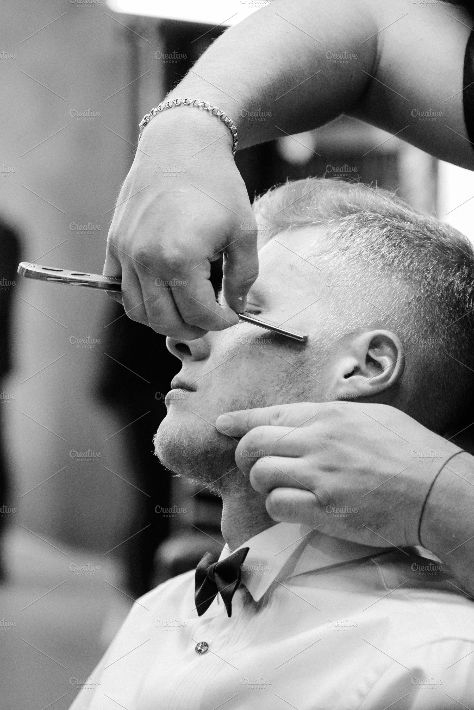 portrait of a young man getting ready at a barbershop, a Person Photo by Weddings, People, Travel