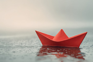 Red Paper Boat on Pale Water Surface, a Photo by Virgo Studio