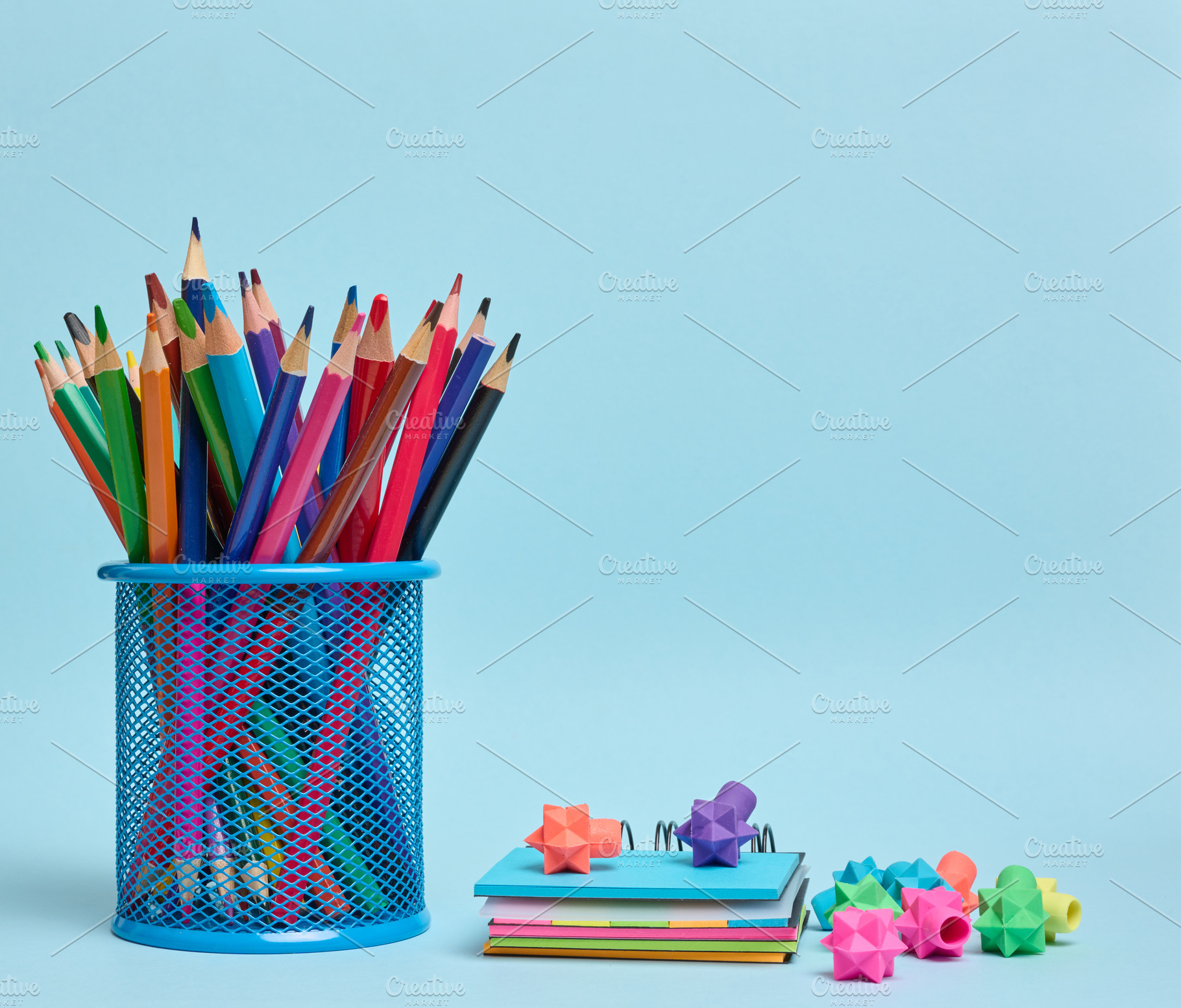 Stationery set colored pencils in a glass and an eraser symboliz, a School & Education Photo by ndanko