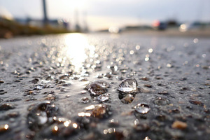 Sparkling water droplets on a surface in black and white, a Background Photo by AlyaAnd