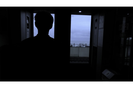 Young man looking through the window, a Person Photo by Media Whale Stock