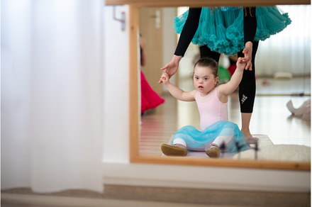 Little girl with down syndrome, a School & Education Photo by HalfPoint