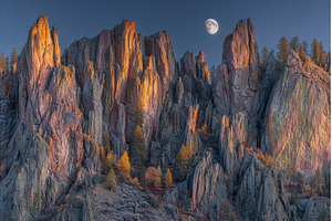 The full moon is visible over High, a Nature Photo by ZinetroN