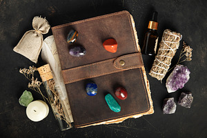 Rustic Leather Journal with Healing Crystals on Dark Background, an Arts & Entertainment Photo by Natalia Klenova's Shop