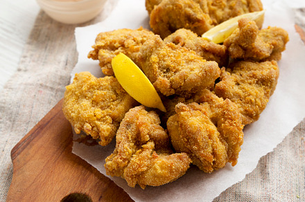 Homemade traditional japanese fried chicken Karaage on a rustic, a Food & Drink Photo by LiudmylaChuhunova