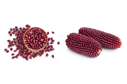Purple corn seeds in wooden bowl, a Food & Drink Photo by NataPhoto