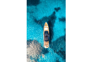 Aerial view of luxury yacht and boat, a Transportation Photo by den-belitsky