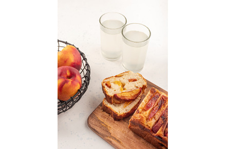 Peach cake loaf on wooden cutting