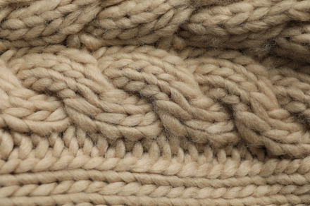 Knitted sweater on whole background, close up, a Beauty & Fashion Photo by AtlasStudio