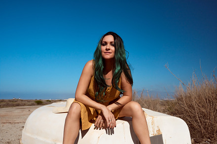 a girl sitting on a boat stranded in a summer landscape, a Beauty & Fashion Photo by YossSabalet