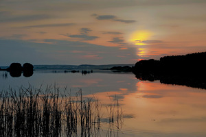 Sunset on the lake featuring sunset, lake, and sky