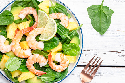 Fresh pineapple shrimp salad with spinach, avocado and lime on w, a Food & Drink Photo by 5PH