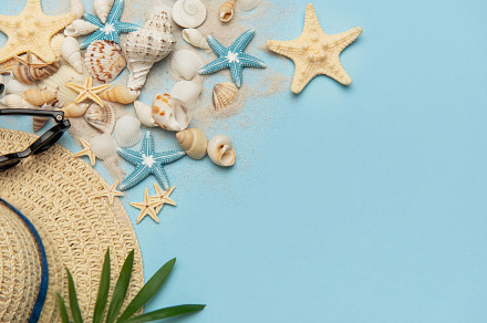 Summer holiday beach background with seashells, sunglasses and s