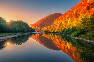 Lake in mountains with red and, a Nature Photo by den-belitsky