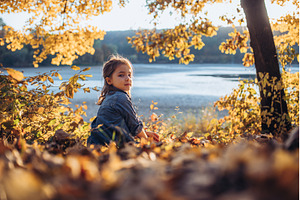 Girl in autumn nature, sitting on, a Nature Photo by HalfPoint