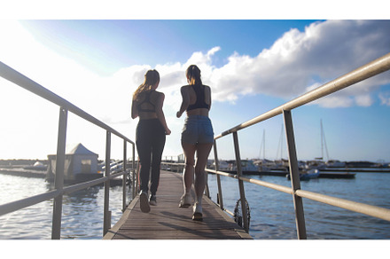 Two young athletic women staged a, a Photo by Barcelona_dreams