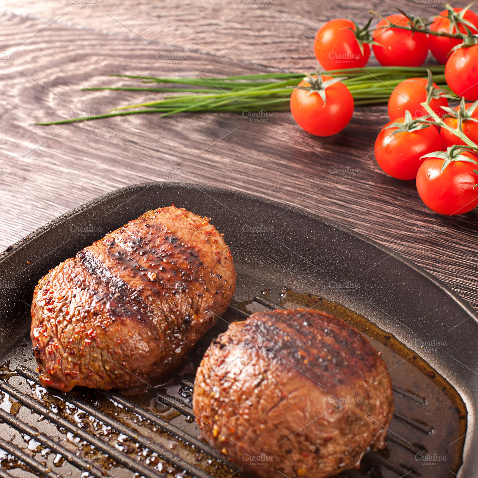 Hot steaks on pan