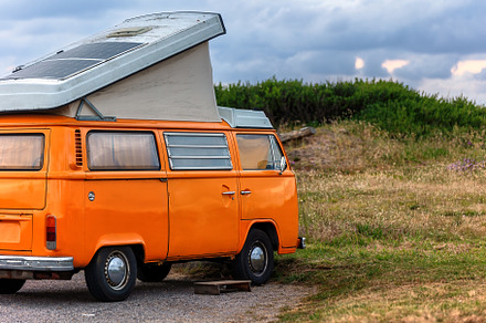 Vintage Orange Camper Van parked out, a Transportation Photo by Perpis