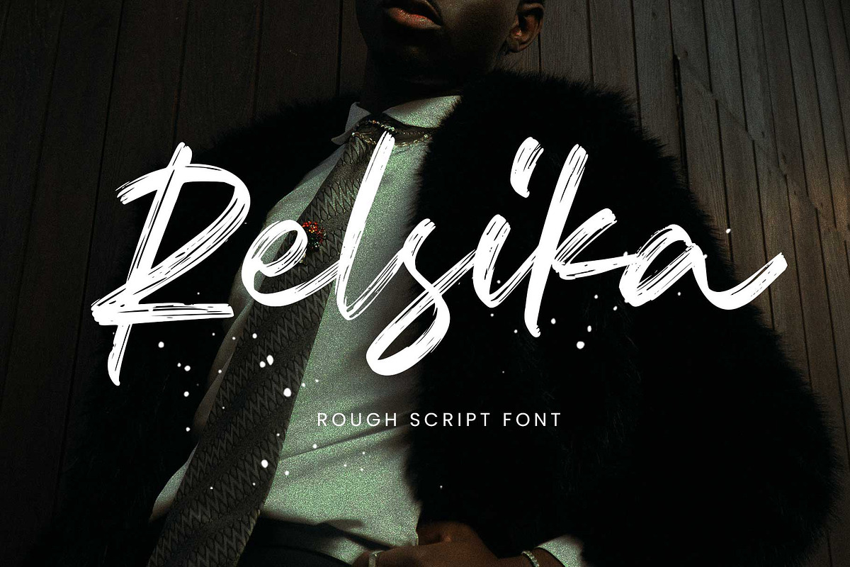 Relsika - Rough Script, a Script Font by Arterfak Project (Photo 1 of 12)
