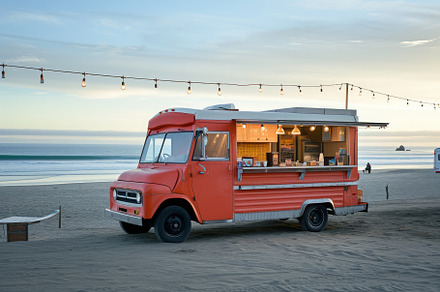 An orange food truck parked on the s, a Photo by Iftikhar Alam