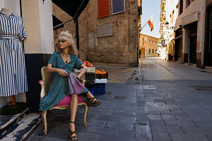 A mannequin of a woman sitting in an armchair on a street in Valencia, an Arts & Entertainment Photo by Bepslabor