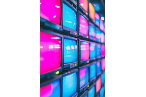 many retro tv displaying neon colors, an Arts & Entertainment Photo by Lermont51