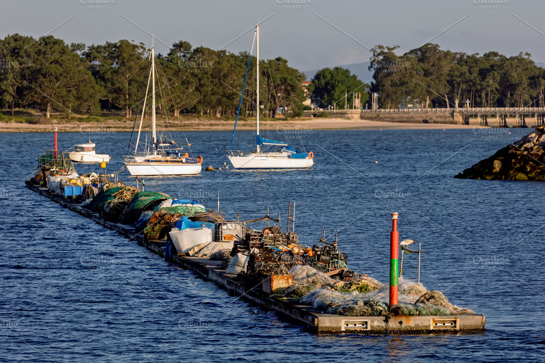 Nets and motors on a floating artisa, an Industrial Photo by Perpis
