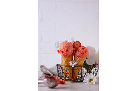 Strawberry ice cream in waffle cone, a Food & Drink Photo by Yulia Furman