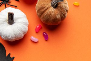 Halloween pumpkins bats spiders and candy corn on orange backgro, a Holiday Photo by Olena Rudo