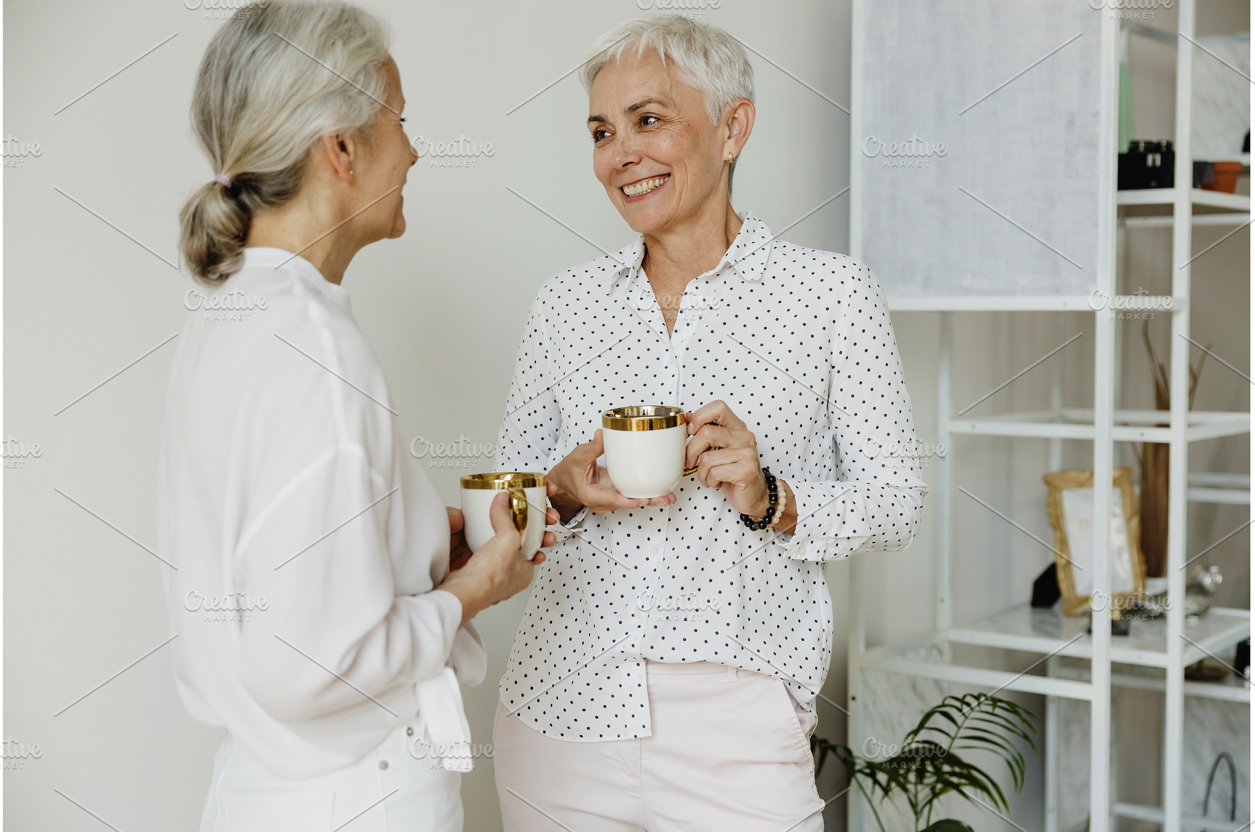 Two smiling middle aged female, a Person Photo by Aliona Serzhanova