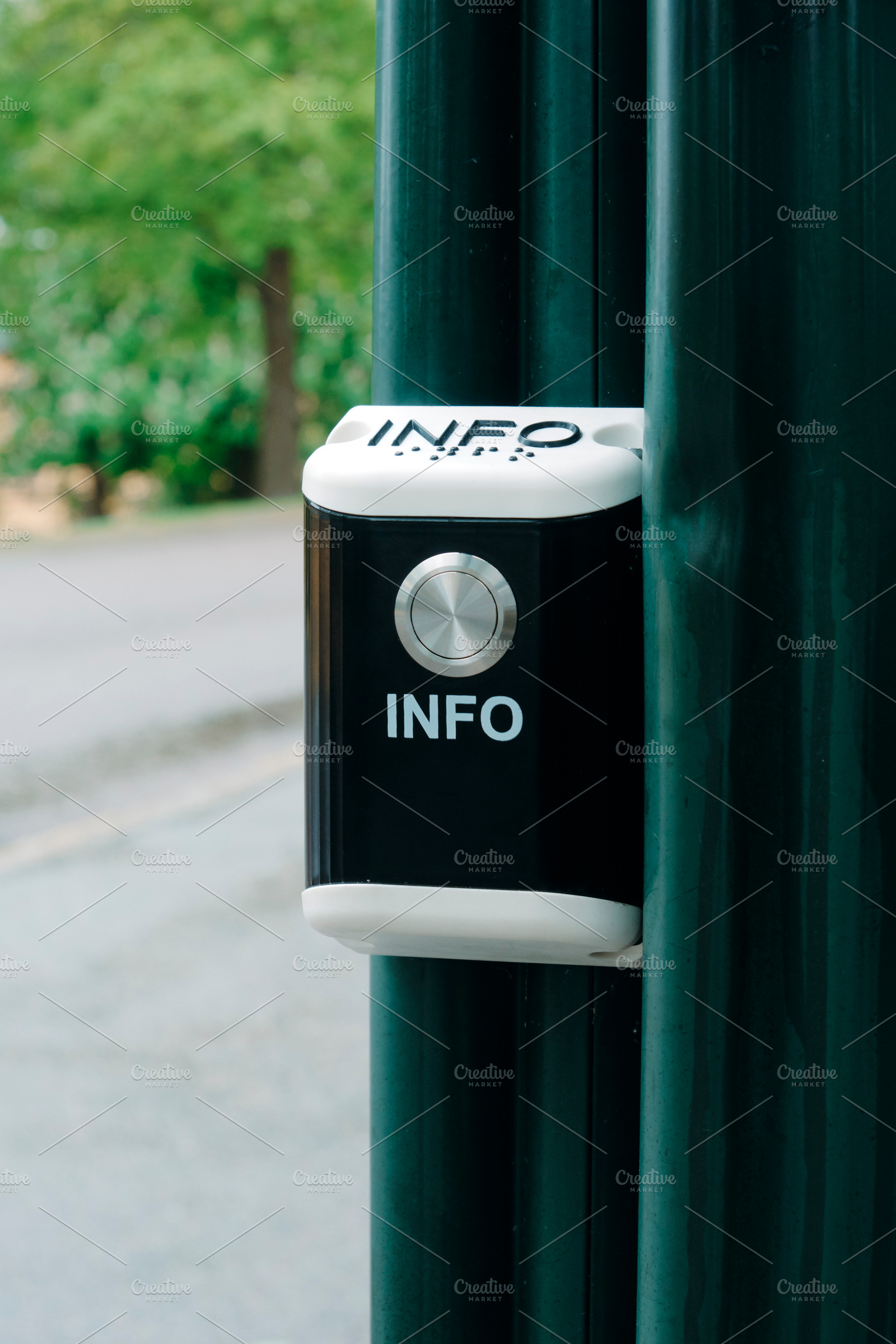 a public information button outdoors, a Photo by Nito