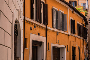 Medieval narrow street in the heart of Rome, Italy, an Architecture Photo by Anna Bogush