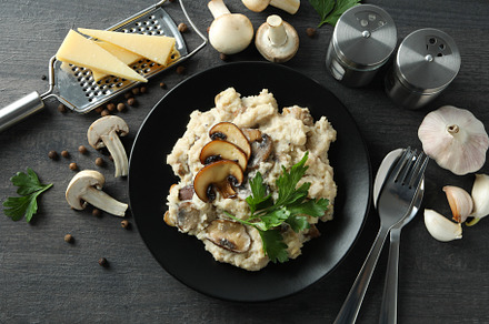 Concept of tasty food with risotto with mushrooms, top view, a Background Photo by AtlasStudio PRO