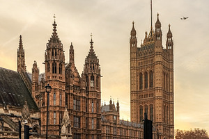 Palace of Westminster and Victoria Tower at sunset, London sky with airplane, H, a Photo by Studio ANNA