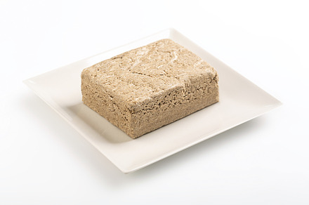 Vegetable-based halva sweet prepared from seeds on white, a Food & Drink Photo by zakiroff