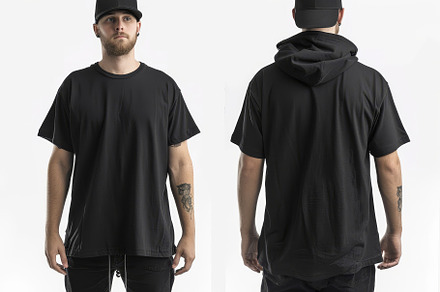 A model presents a modern black over, a Photo by Tanuart