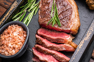 Deliciously charred grilled New York strip or striploin steak wi, a Food & Drink Photo by composter-box@mail.ru