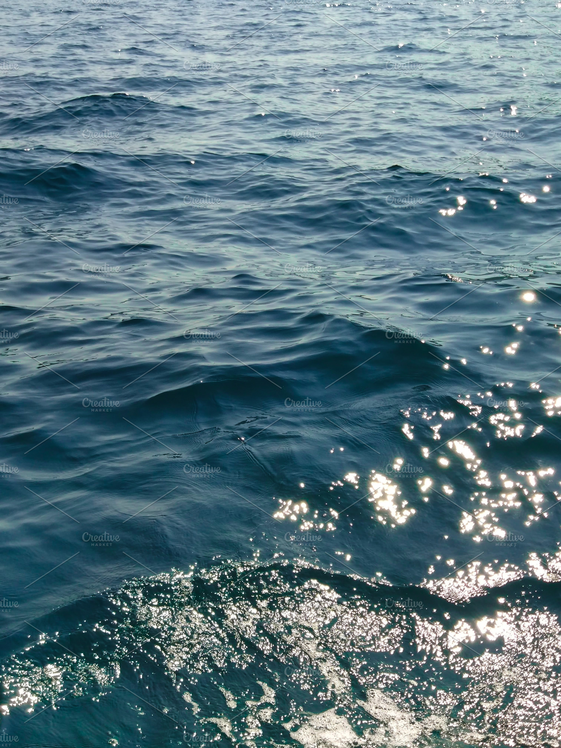 Water surface with waves and sunny r, an Abstract Photo by Photo by YuraYaryna