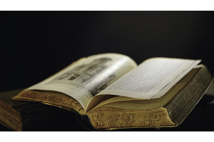 Male hand turning pages of old open, a School & Education Photo by Media Whale Stock