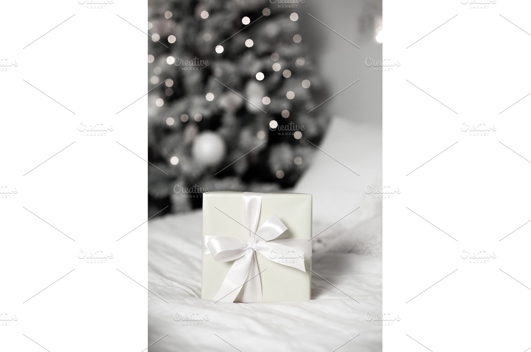 Gift box on bed with christmas tree, a Holiday Photo by Anna Efetova