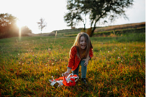 Girl playing with a rainbow hand, a Person Photo by HalfPoint