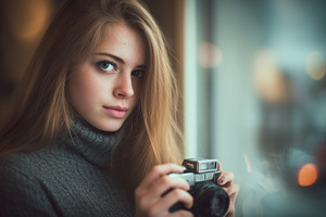 Young woman with long blonde hair, a Person Photo by MistyDay