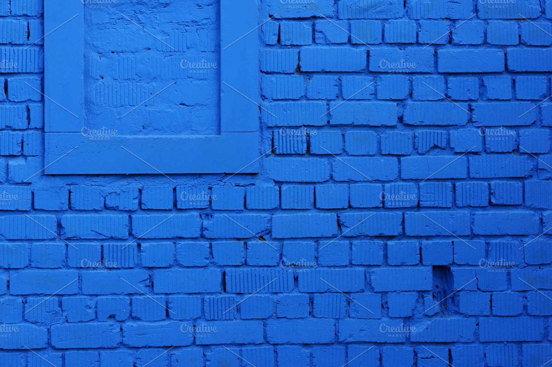 Blue brick wall featuring wall, building, and architecture