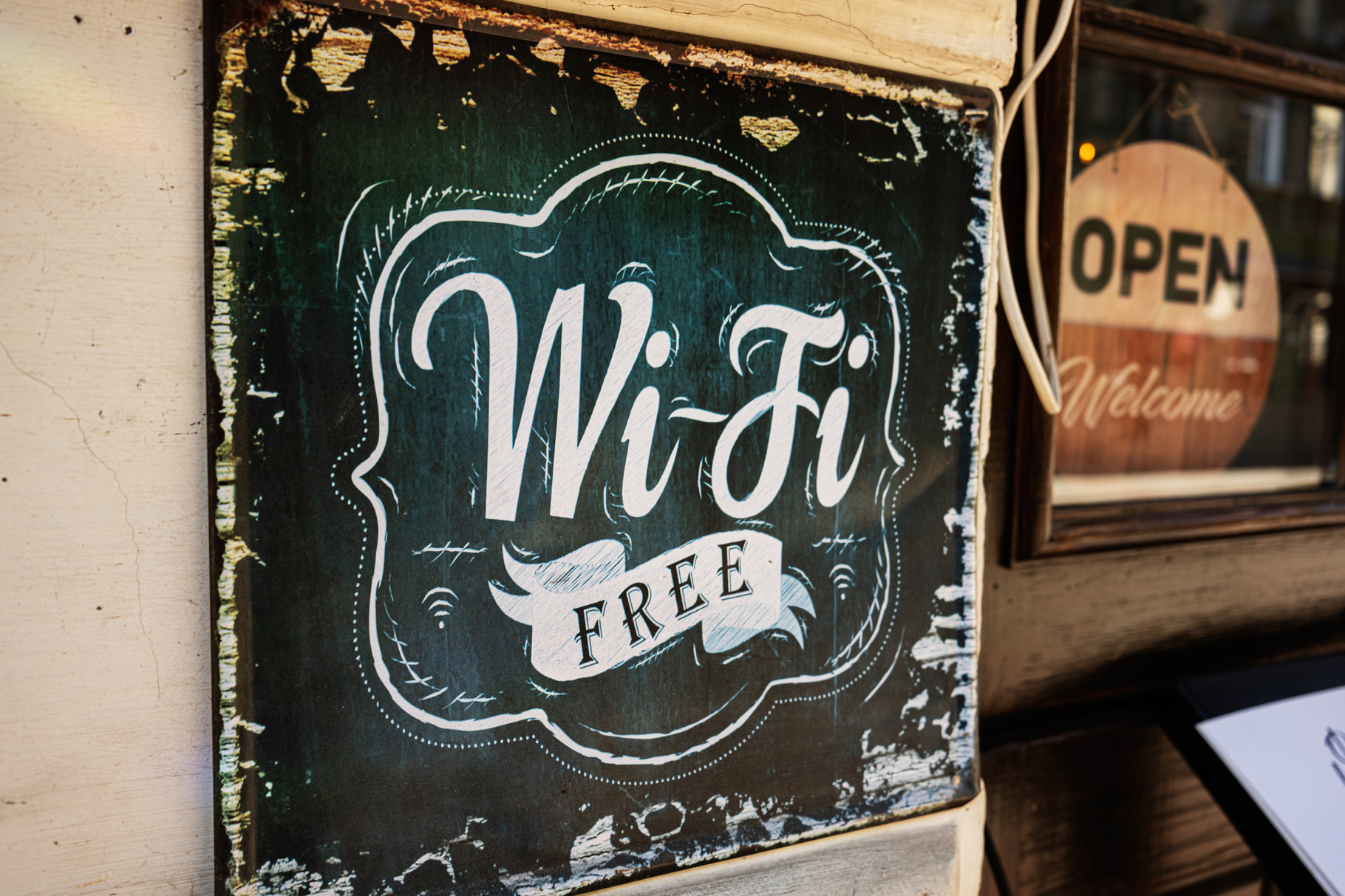 Rustic sign advertising free Wi-Fi outside a vintage cafe, a Photo by ...