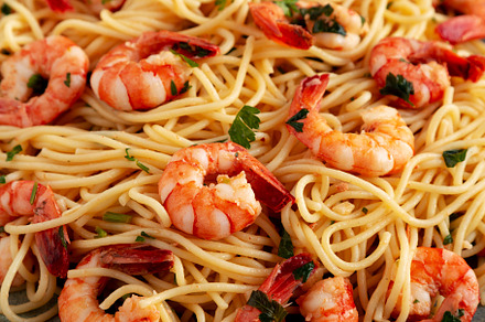 Homemade Cooked Garlic Shrimp Scampi on a Plate, side view., a Food & Drink Photo by LiudmylaChuhunova