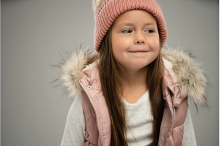 girl posing in warm jacket and hat, a Person Photo by OPOLJA