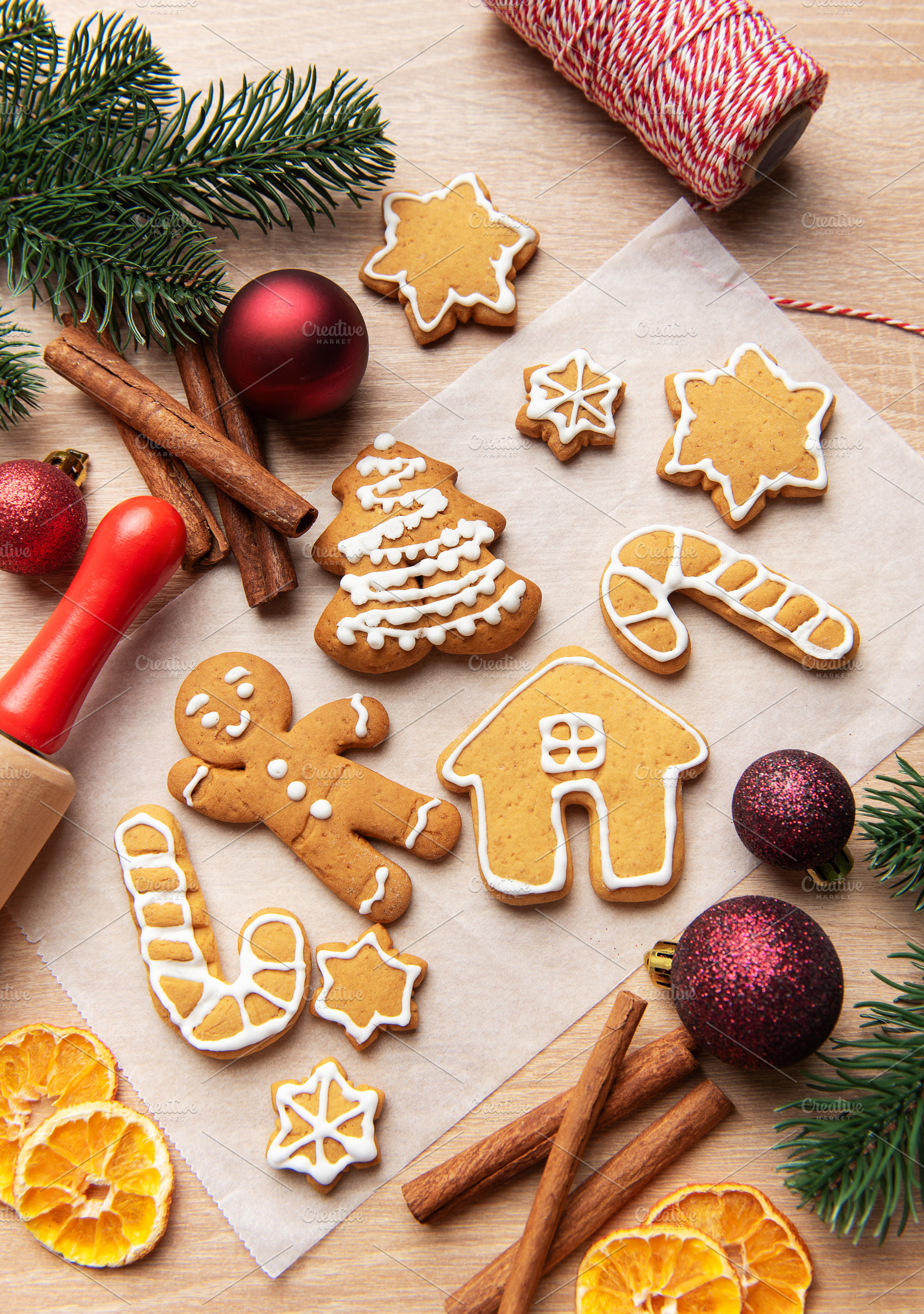 Homemade gingerbread cookies on baking paper for christmas, a Holiday Photo by Olena Rudo