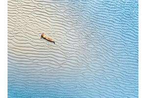 Aerial view of sporty woman in, a Nature Photo by den-belitsky