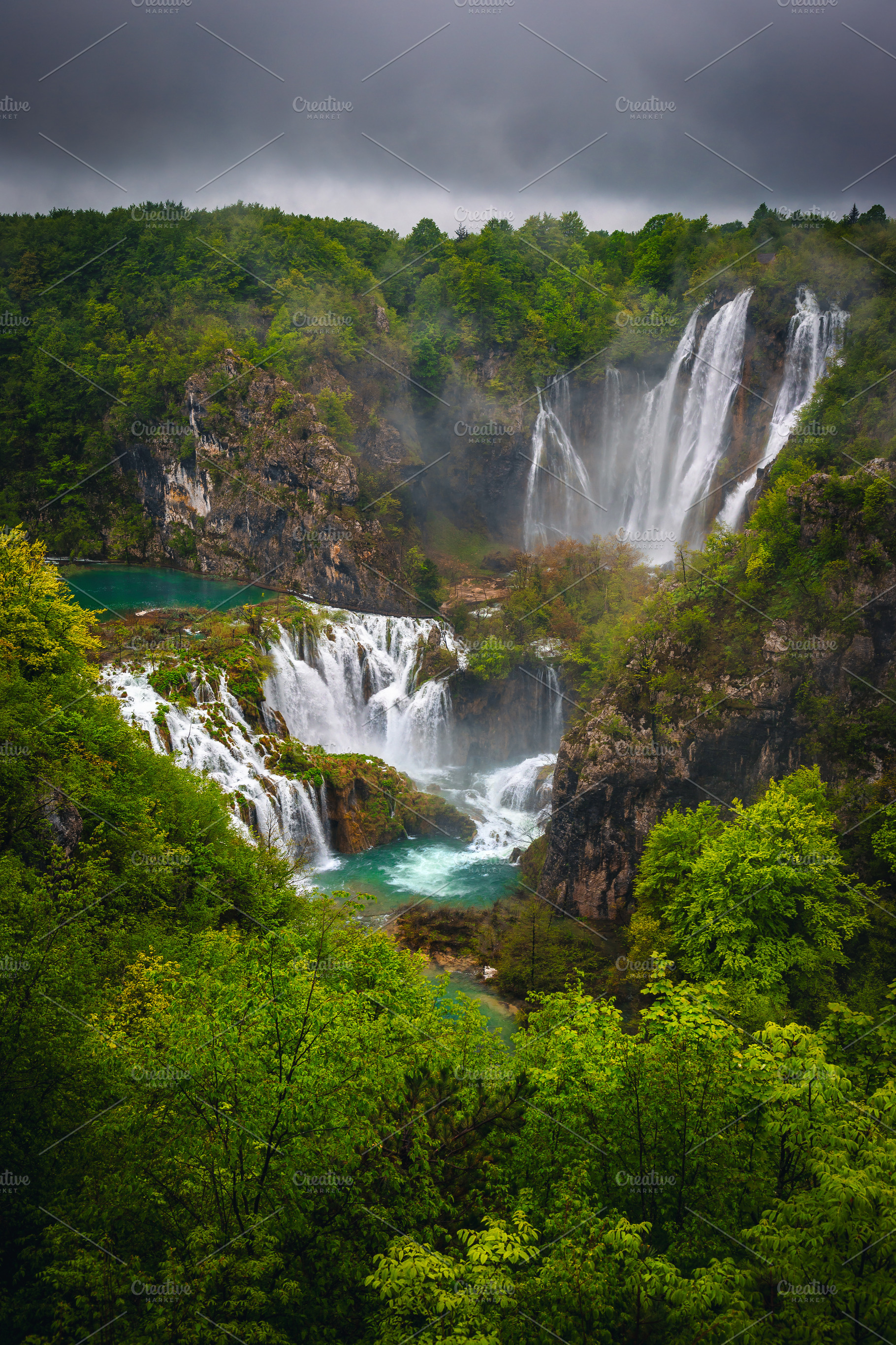 Big waterfalls in the green forest, a Nature Photo by Alpine Dreams