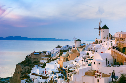 Oia at sunset santorini greece containing windmill, sunset, and sundown, an Architecture Photo by kavalenkava